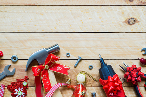 carpentry tools wrapped in christmas ribbons